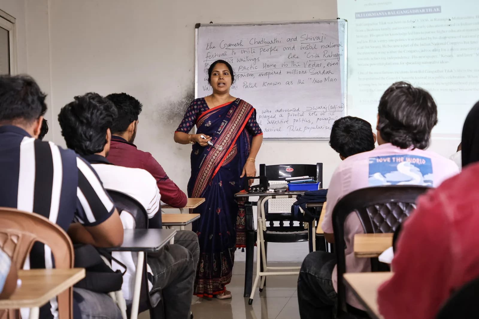 Teacher speaking to students in a classroom
